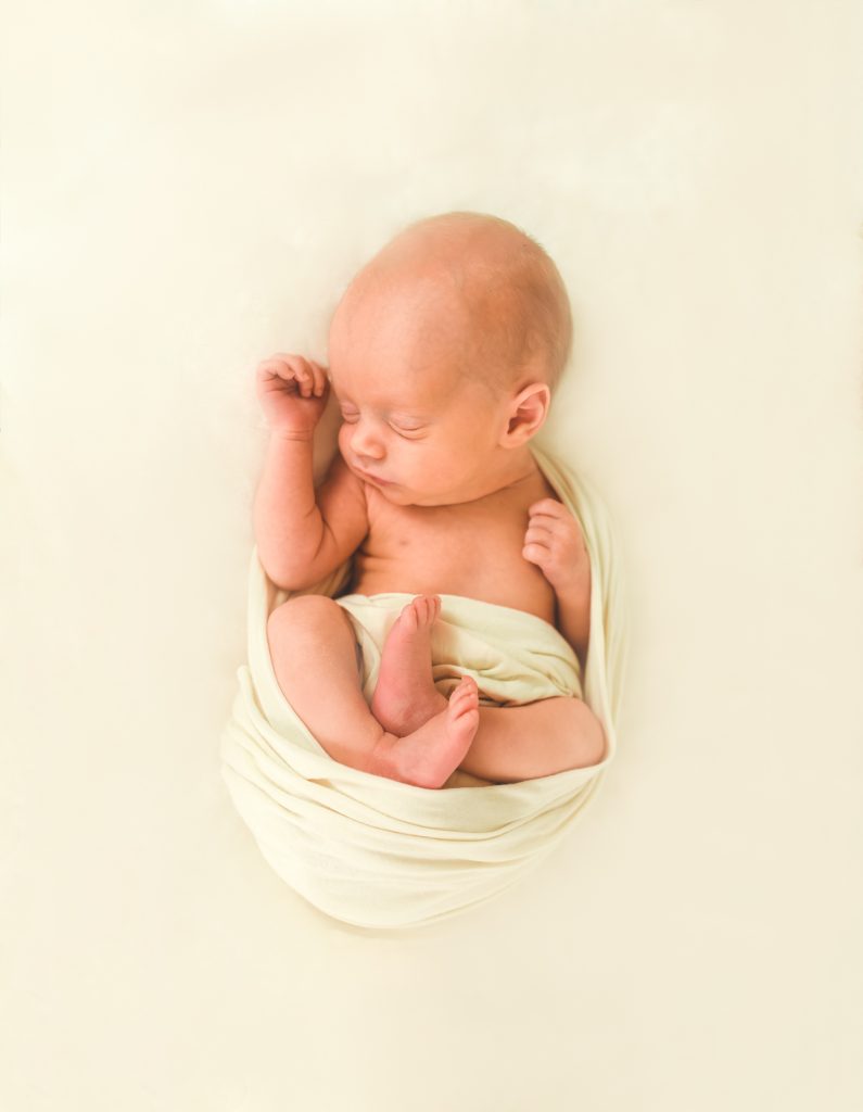 newborn baby in womb pose