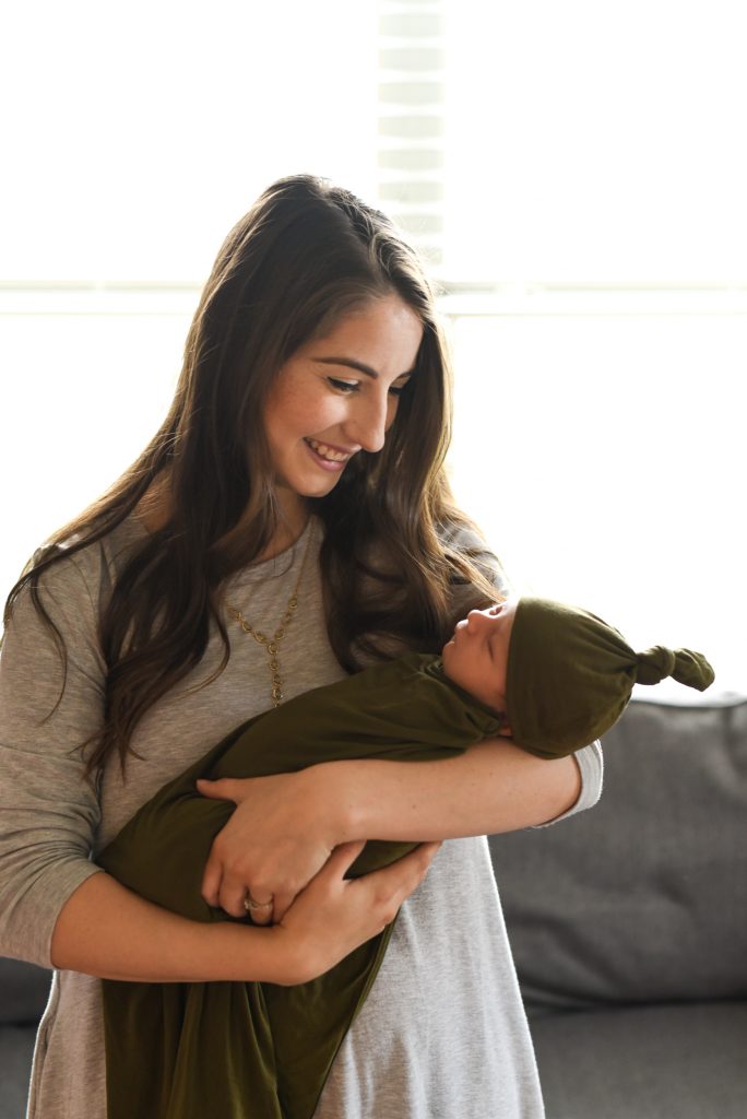 mom holding newborn baby