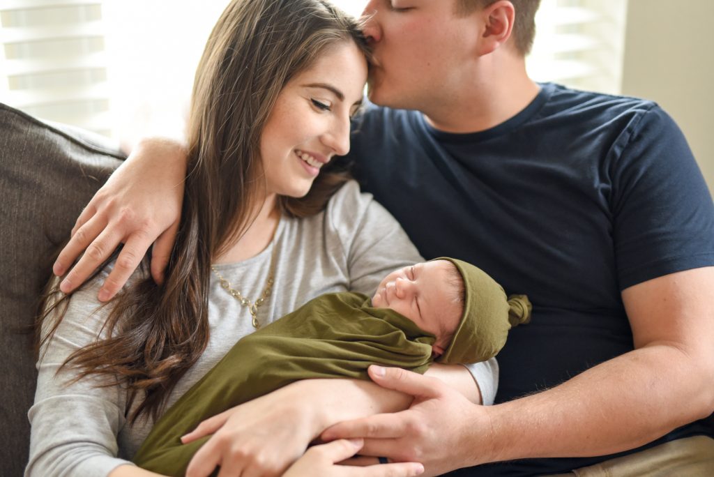 New baby photographed with parents